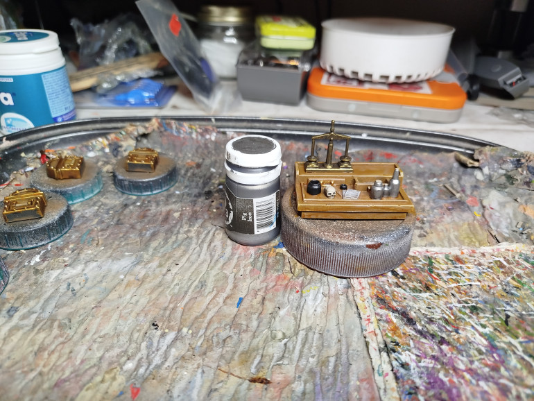 Lightly drybrush the ink wells to make them feel metallic
