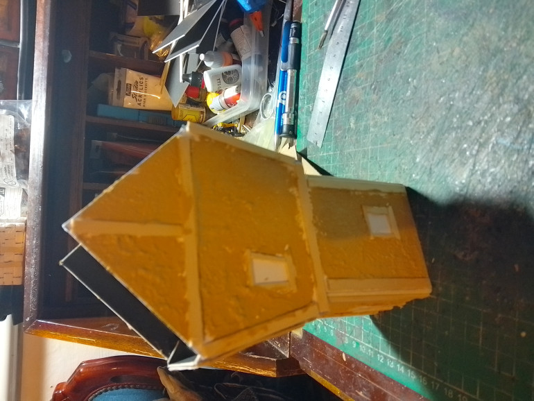 To give the walls some texture I coated the plain areas in textured basing paint