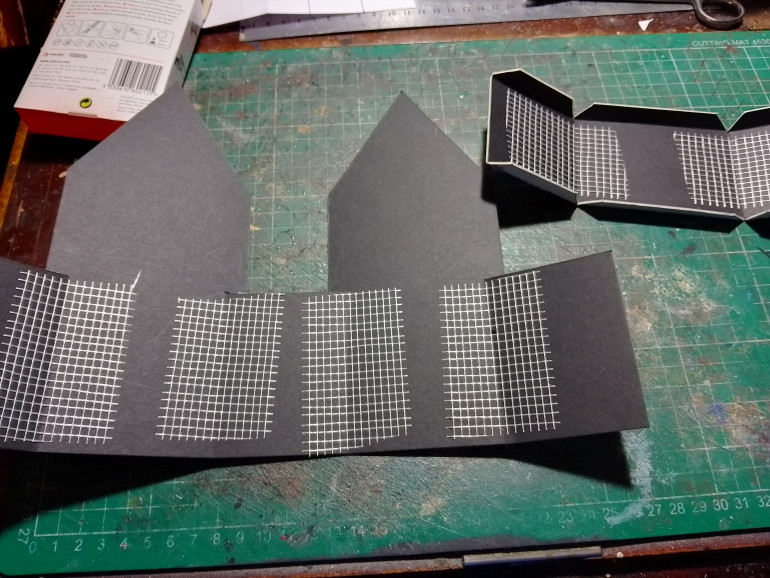 Added some dry wall tape to give the folds inside a bit of strength, on the outside edges I added a layer of masking tape