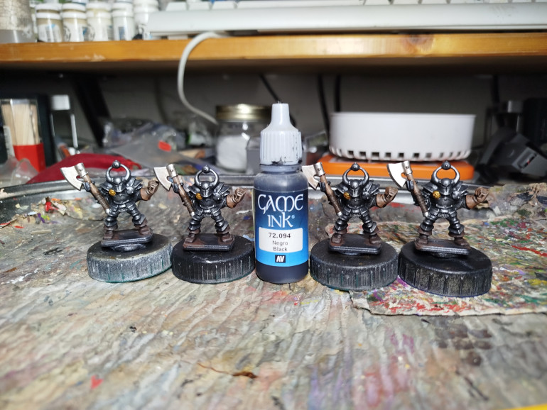 I put some black ink in the eye slots to make them deep and dark.  I considered putting in a glow to match the colour of each of the 4 chaos gods, but I like these models as dark and menacing.  Bright pink and green eyes felt like they might silly it up a little.