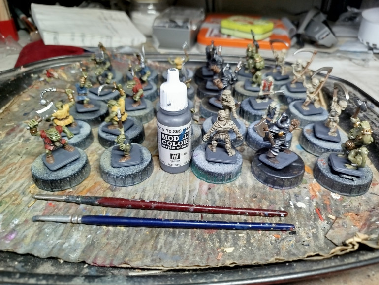 Base coat the bases.  I'm keeping them simple.  Any decorations would swallow the feet, which are already a little sunken in to those bases.