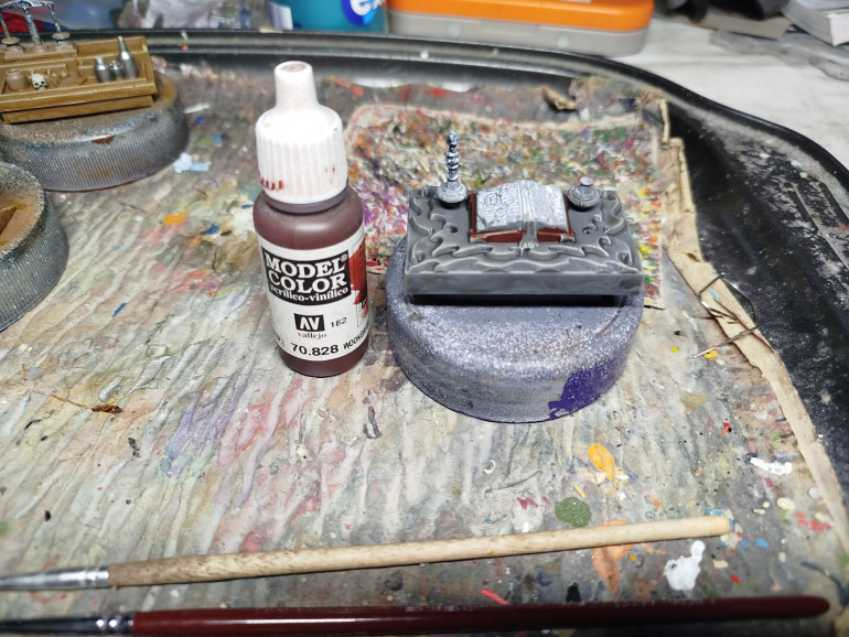 Paint the books leather/lecturn or whatever that is.  Possibly both moulded as one.