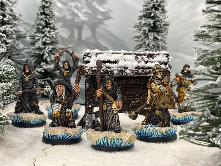 The first elements of the warband make their way through the wood