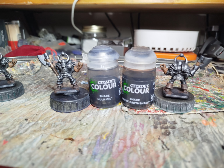 The boots were washed with Nuln Oil and the other leathers were washed with Agrax Earthshade