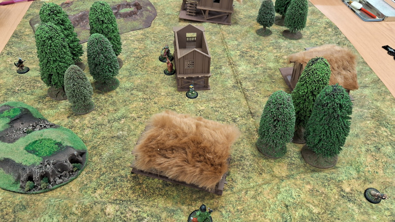 Based on warband ratings, Trevor was the defending player and placed his warband around the central objective building and I deployed around the edges of the map in various locations. Note: Due to a lack of familiarity with the warbands, we both forgot about Trevor's moles having the Tunneller skill so they deployed on the board.