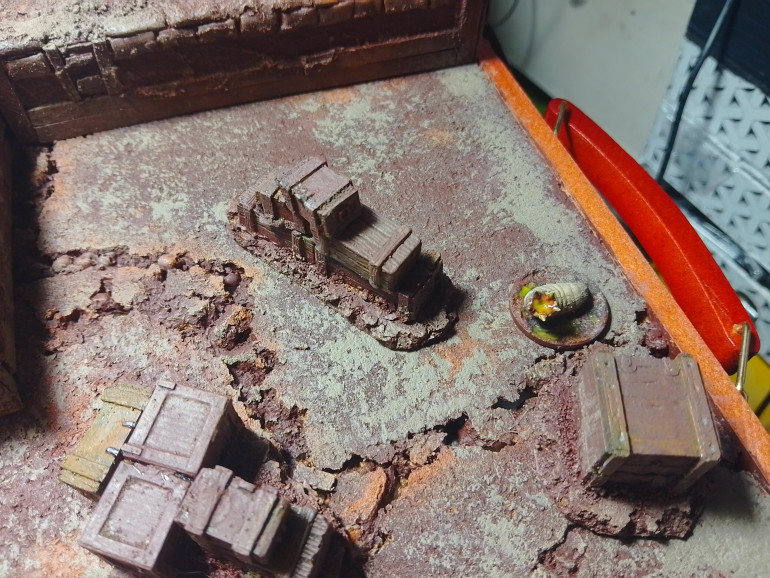 The noise of battle has attracted something from the mist, before they see it they can smell the stench of decay, before a giant trench maggot squirms into view. Corelli is too close and gets dragged into combat with it, it's gaping maw surrounded by razor sharp teeth causes a seriouse wound so he breaks from combat running to safety leaving the supply crate behind.