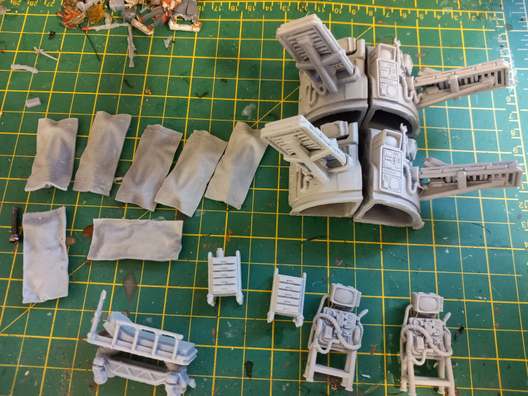 I found these prints available from David Sheff models. Giles only £3 and give some nice scatter terrain for my clinic. Some thing I really wanted was body bags. Entering a facility and finding lots of body bags is never a good sign. Also nice beds and gurneys 