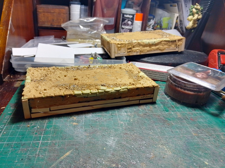 Next it was time to stick on some sand and ruble texture then splashed on some texture paint to create thick mud