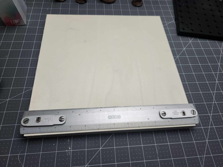 If you're making terrain tiles, try out wood canvas boards. Consistent size, actually measures 12x12 inches and prevents warping a decent amount for when you start gluing pieces on top.