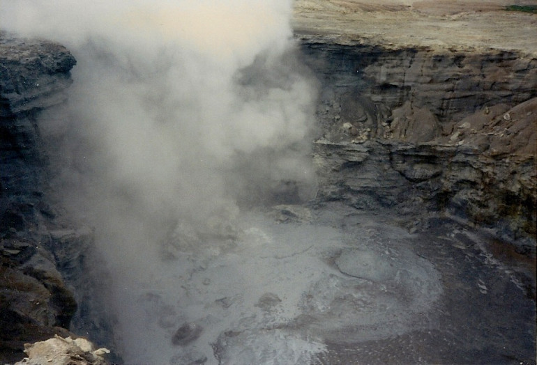 Steaming hot mud pool. A lot of excess equipment was tossed in after the battle.  