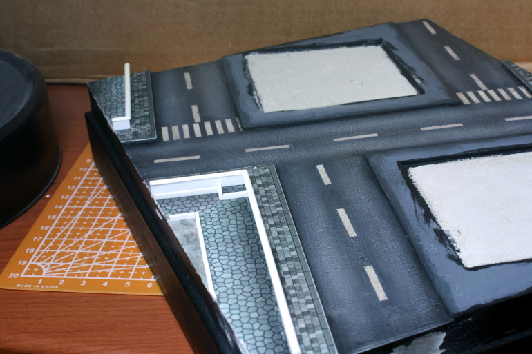 Using printed paper and styrene strips to build up detail.  At this scale paper works very well.