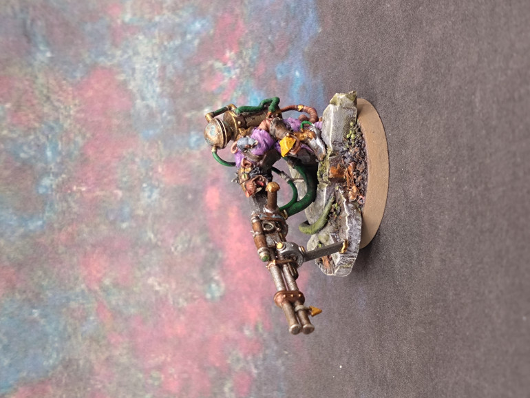 I spent a few more hours on it the night before the event and realised at that even at this late stage that there was still some grey plastic showing in one armpit and part of the gun stock. Even, under closer inspection, that the metal face piece should only be over the left eye. It was nice to give the model a bit more love. I am more determined to get the Skaventide box finished off.