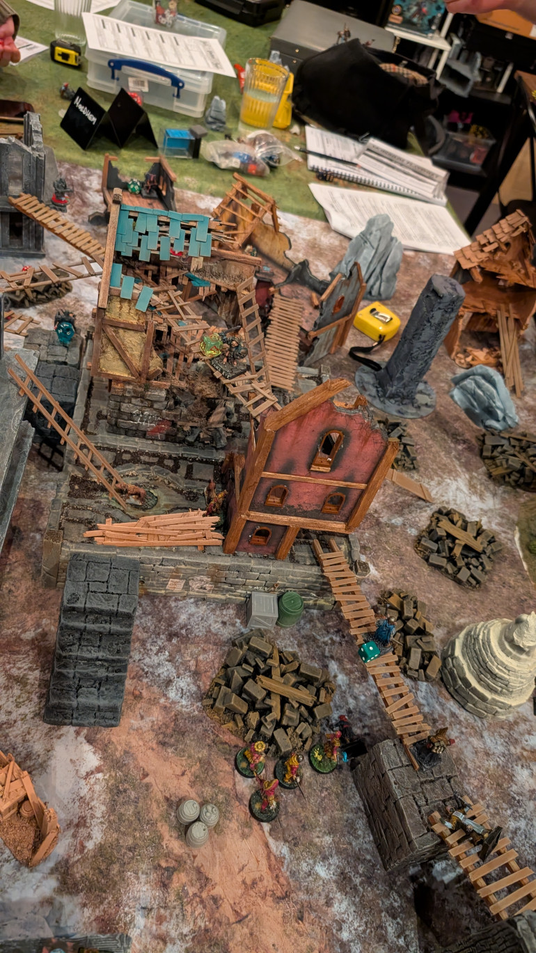 Mutant about to dive into battle, while a beasman safely helps himself to wyrdstone