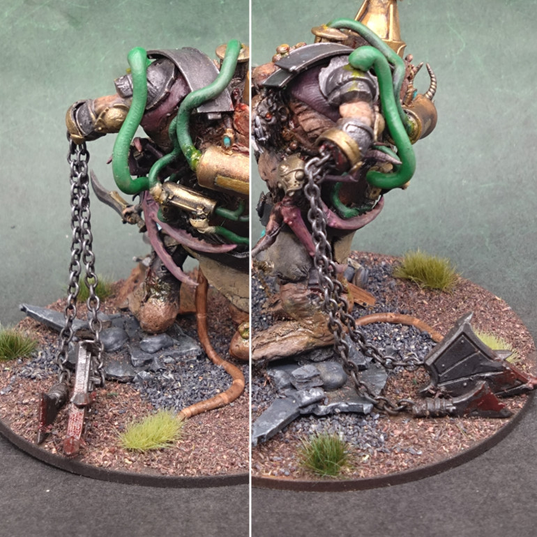 The flail chain is a bit long, and his arm a bit short, but in my head canon his huge shoulder beneath the arm and the pipe direct into the arm give him the strength to wield the flail. The blades of the flail are a bit box odd angled blade and a Mantic Games ogre shield.