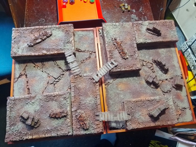 Painted everything brown then went over it all with a sponge and various browns and greys. Once that all dried I splashed a load of mud textured paint on everything