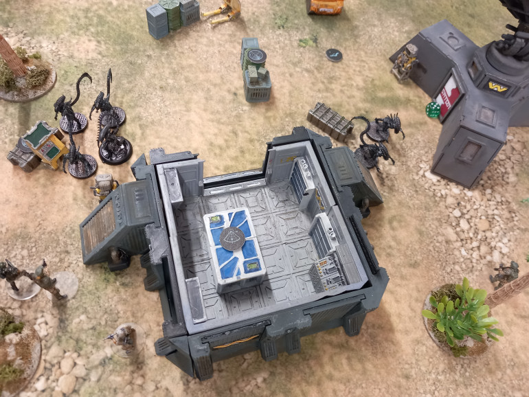 With xenos building up the fireteam kill three before moving up either side of the comm control room.