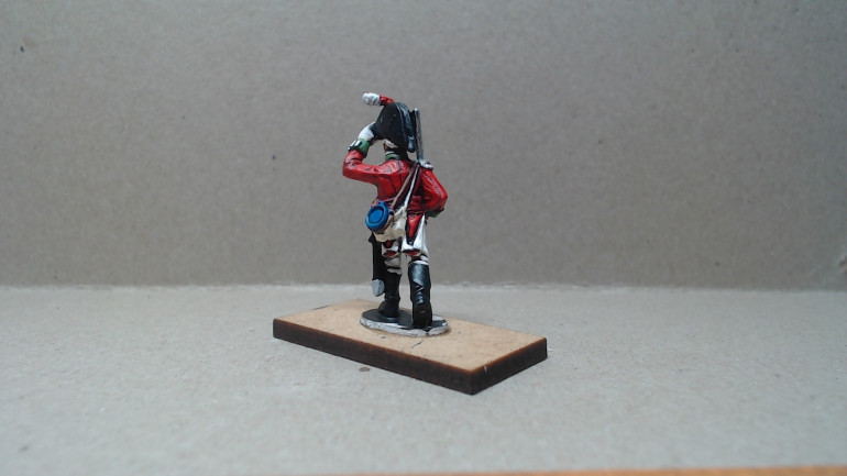 A man in his mid 20's his hair is pure white from fright after first encountering a Kelpie during everyday military duties he lobbied for the creation of this unit. The gloves are worn because during the encounter his hands were stuck to the creature and he had to tear them off leaving them badly scarred. 