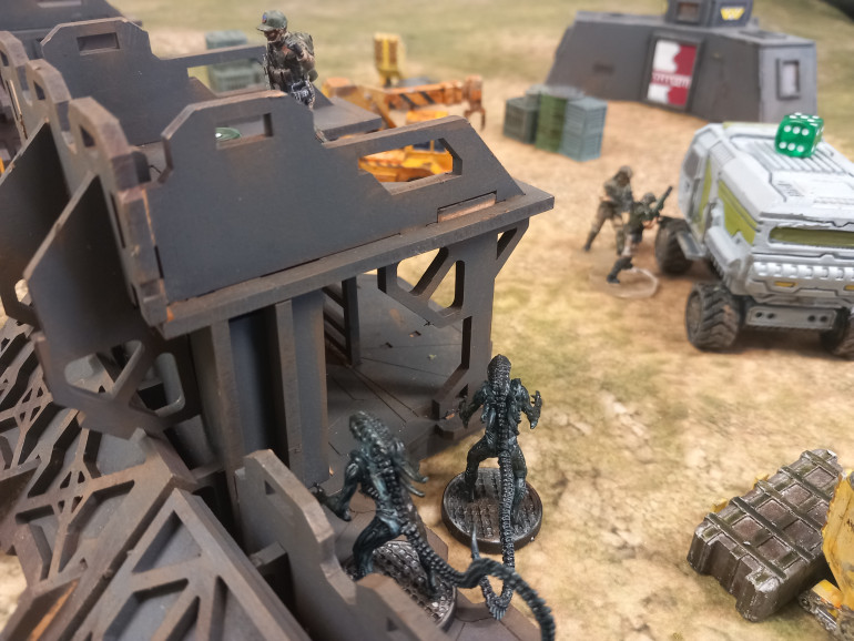 The beeps get closer. Armstrong mounts the wall and calls for extraction as his men complete their task. 