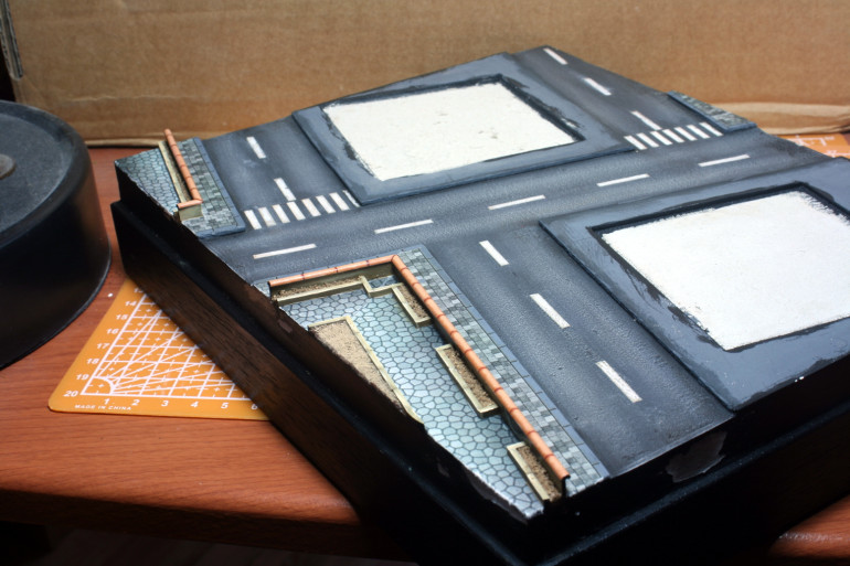 Painting up the little walls of the park and touching up the paper work.