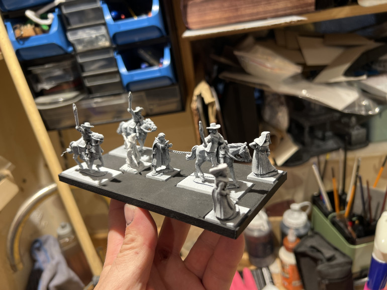 Here is my converted witch hunters escorting a poor soul to some aweful fate. I may make a ducking stool to have as part of the nutbag wagon train.