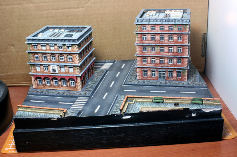 The building weathered up and fixed into place along with the paper pavements.