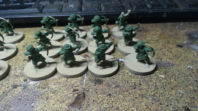 I like the idea of the Hobbits turning up in normal clothes to fight and being given some modified helmets and Gambesons the same way Theoden and Denethor armour Merry and Pippin in the books. It's both a sign of respect and appreciation of their coming and helps unite the Hobbits with the rest of the army.