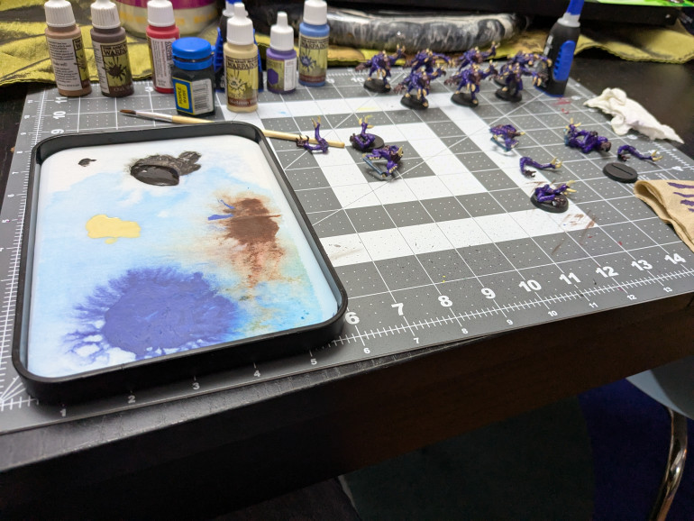 Wet palette, paint bottles, and models