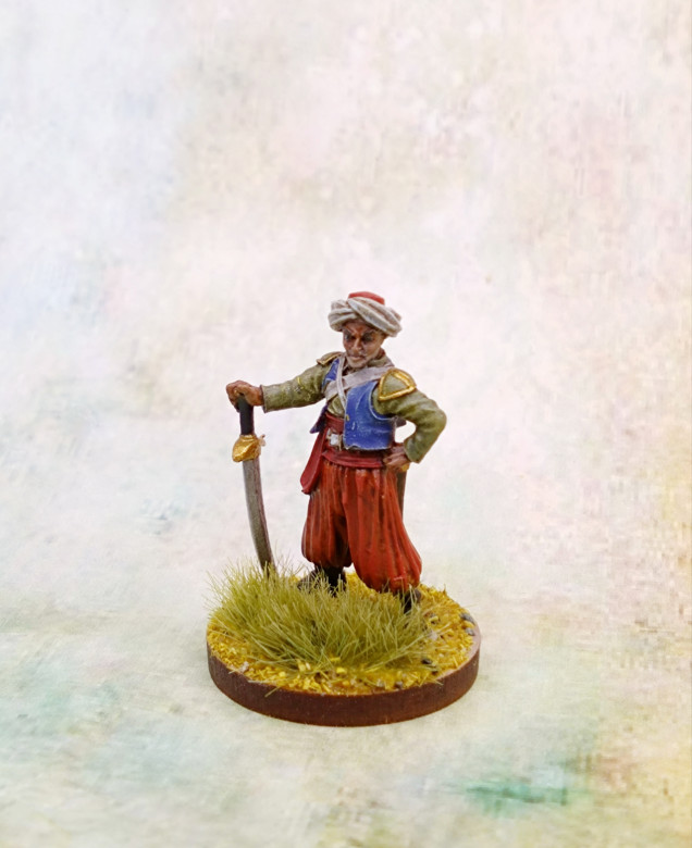 I used Death Guard Green, Macragge Blue, Mephiston Red on the sash and Wyldwood and Black Legion Contrast on the boots and equipment.