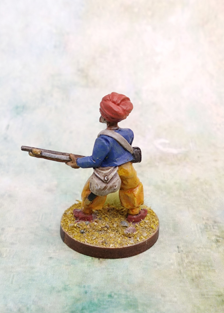 The skin was mostly achieved with an Agrax wash over Cadian Fleshtone. This came out too glossy so I did a highlight mix of Cadian Fleshtone and Mornfang Brown to cover the worst of the gloss effect.