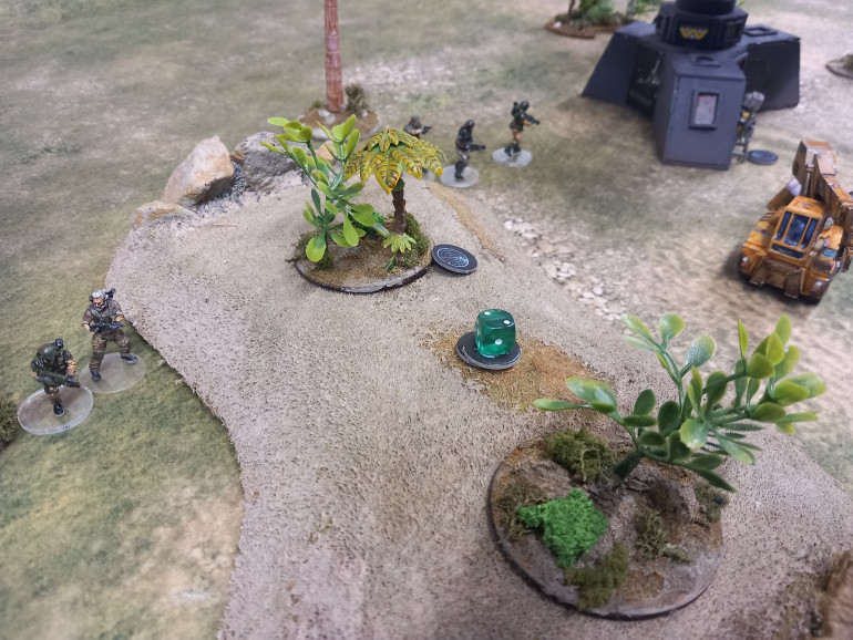 Turn 2 has aliens get revealed but are caught in a cross fire from both sides of the hill allowing one objective to be secured.