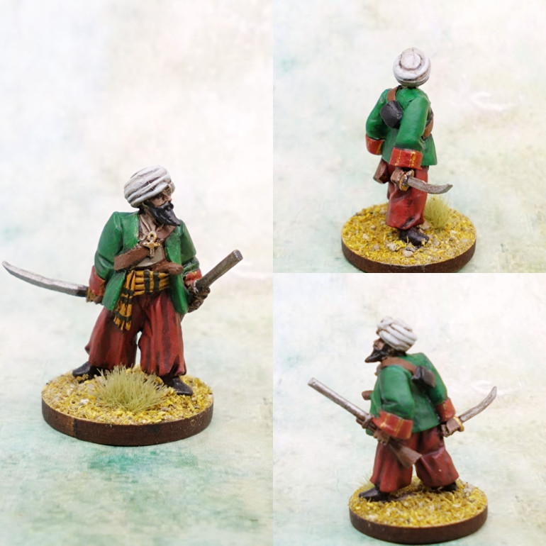 This version is quite different, I think I prefer the Gringo version, but this is still a good model. The cuffs were fun to paint. A wide gold band laid down and then parted with a red line to make it look more intricate.