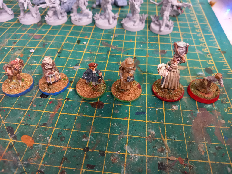 The problem I had last time I played the game was players weren't sure what minis were theirs when every mini is a civilian. Each team gets a young lad and female mini. I colour coordinated the rims of the stands so people know who is who