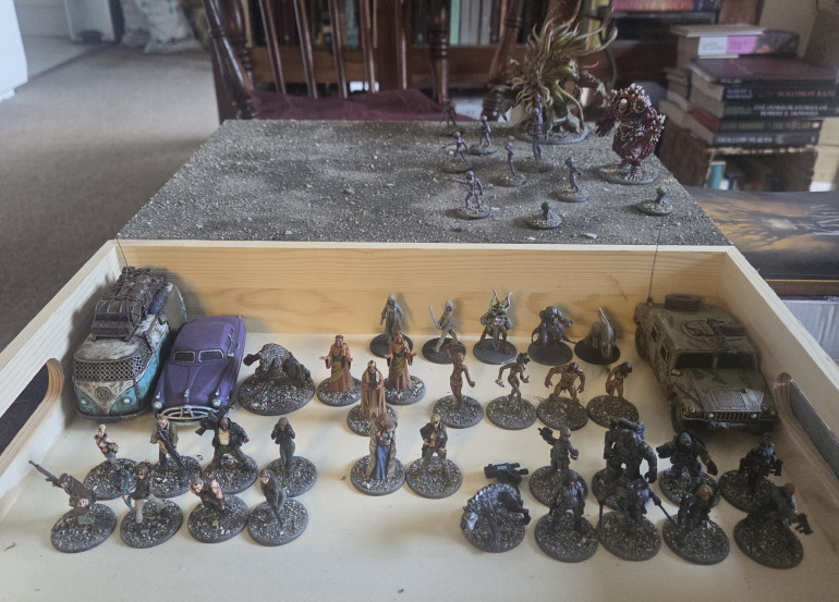 I started off with the Aliens as they were only two colour and should make an easy start, I then realised I need to document this so I took this photo of the painted Aliens and two monsters along with the box of other models.