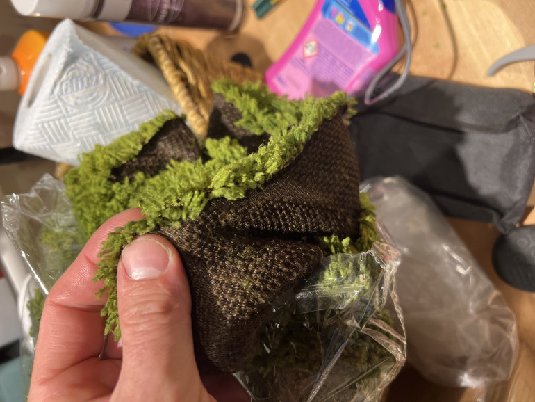 Here you see the very soft and playable backing. This is so much more useful as it’s annoying trying to get the mats to lay flat instantly the winter. My mats needed me to glue on flock and the glue has a mild memory and won’t go flat without weights. This is also better for storage as they can be stiffed into any old way/shape and still lay flat on the table. It’s an architectural decorative moss, yellow green from Temu for £17. I’m hoping to shave it slightly like the napoleonic gamers do with ready bear fur. If this works well I’m going to make this the mainstay of my travel sets for massive games. Buying ten of them for a 8 metre by 2 metre table and use the last two to re cover my hills etc. Will be an improvement!