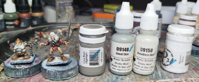 Base coat the white hair with a mix of Reaper MSP 09148 Ghoul Skin and Reaper MPS 09150 Bloodless Skin.  Wash with P3 Cryx Bane Highlight.  Drybrush with some Bloodless Skin, then add some white and repeat.  Lightly drybrush with just white on select areas only.