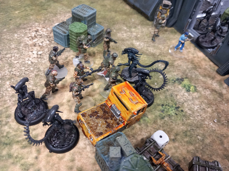 Distracted the marines don't notice the aliens spawning from the board edge.