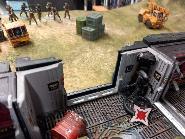 Rattling fire tore up the xenos only one survived using the cover of the building.