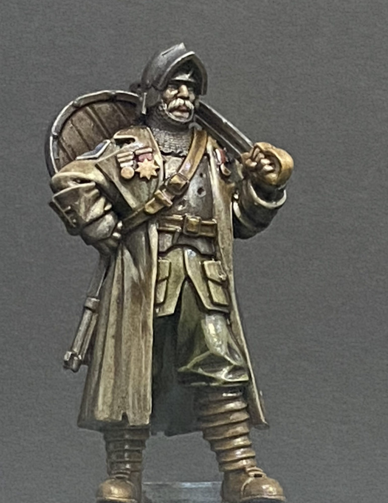 My first chap all painted up and ready to lead the forces of New Antioch against the worst the Gates of Hell can throw at them.  I went with a WW1 feel and a rather muted colour scheme.  