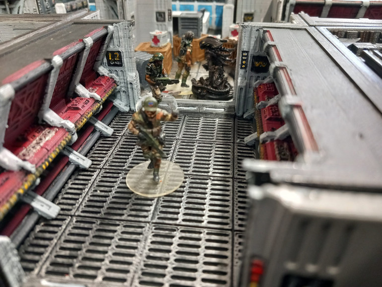 Armstrong makes a break for the exit while marines try and clear the way. Vice has a weapon jam and two marines holding back the swarm are killed by acid spits