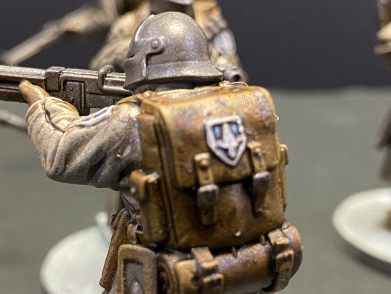 Another Trooper of some sort.  I have yet to actually read the rules and have no idea who or what he is so we will just call him Brian for now.  Painted in the same way as the first and also sporting a blue unit badge.  I promise that is a dog hair, not a pube.