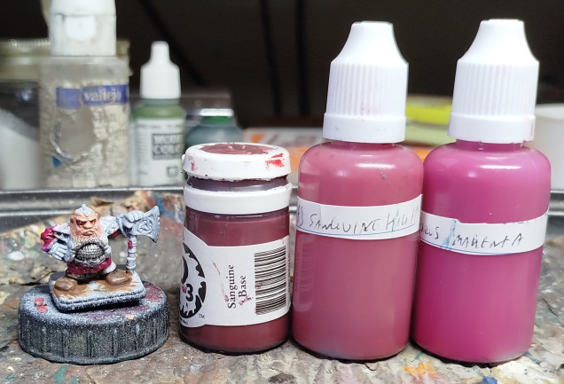 Base coat P3 Sanguine Highlight.  Wash with P3 Sanguine base, then drybrush and edge highlight with P3 Murderous Magenta