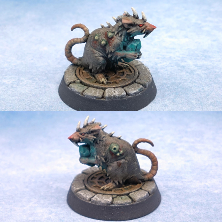 Bit of OSL from the gem. Very basic. Just drybrush white on the fur as well as the gem and apply the Contrast Green over the whole area. Redo some of the flesh on the paws and the effect looks OK. The skin on everyone was a random mix to give me some variety. It was from Sunburst Ochre, Ruddy Terra, Ivory White and Fiery Vermilion to make a red pink for the nose. The grey for the fur on this model was shades and some Ironclad Grey.