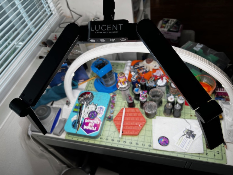 After using one of these at a convention's painting area I had to pick a Lucent light. It is so versatile and has multiple bulbs and setting.