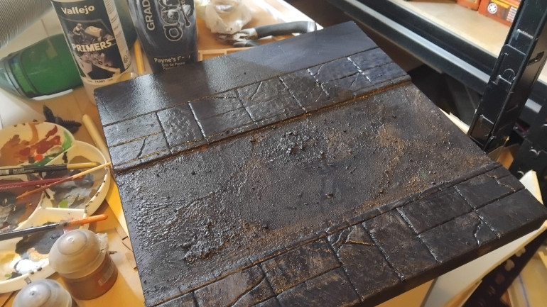 Painted the whole thing dark grey with cheap art paint. I'll do a second coat then hit it with some vallejo primer through the air brush before weathering and flock.