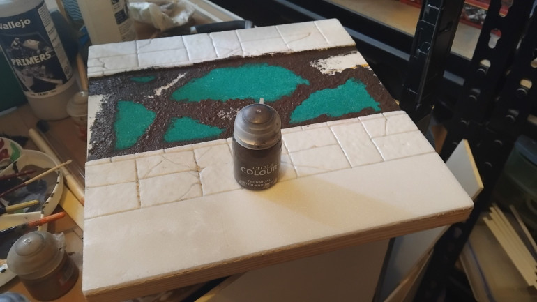Added some textured paint to the edges of the sand paper and some small stones and sand to damaged areas.