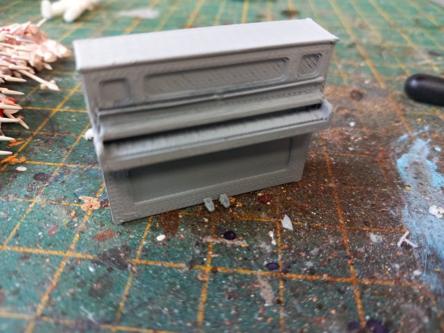 My cabin has been sitting in the corner looking groovy but I still haven't completed the interior. Now I have a 3d printer I had a look for a decent piano which I scaled to fit my room.