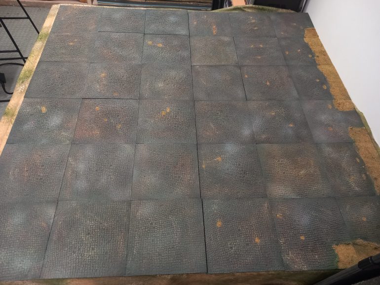 I've been printing a new cobblestone board for my games. I've found my mat is too shiny. I plan to add green spaces using these tiles but I've started with a basic cobblestone ground 