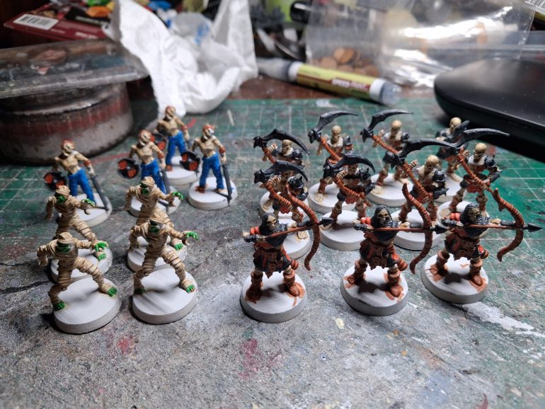 Once that was dry I blocked in the basement colours using pallid bone, hardened leather, magic blue, orc skin, fire giant orange and grim black