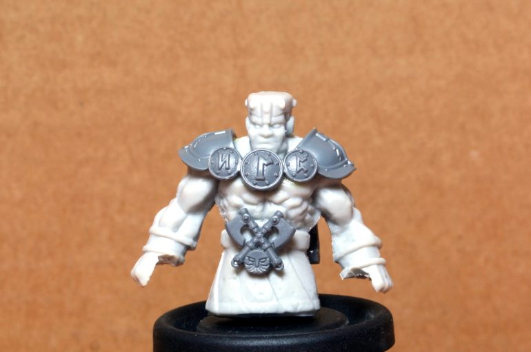 I cut of the legs and added some armour.  The legs were cut in order to fit it with the cart.