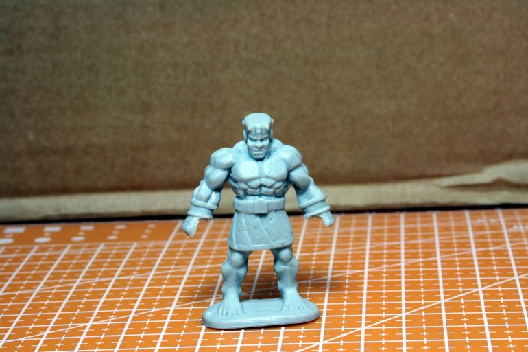 The original golem from Reaper.  I have cut out the fists in order to grab the cart.